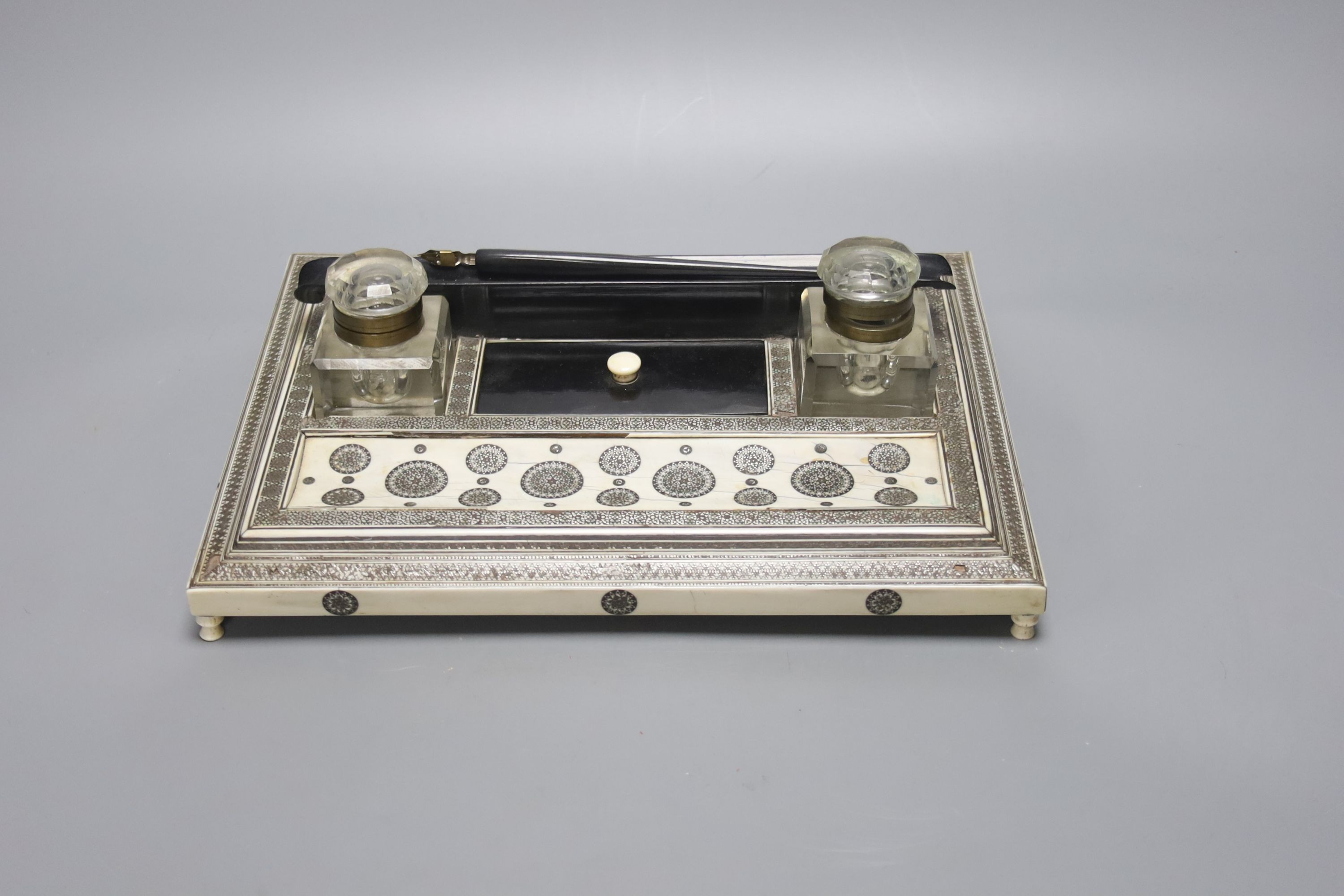 A 19th century Southern Indian ivory and ebony sadeli work inkstand 29cm